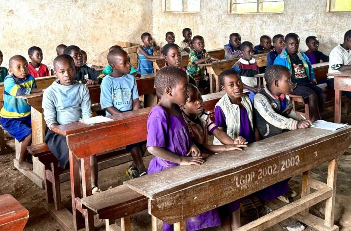 Students in a crowded classroom at Musamba Primary School, Kabale District, Uganda