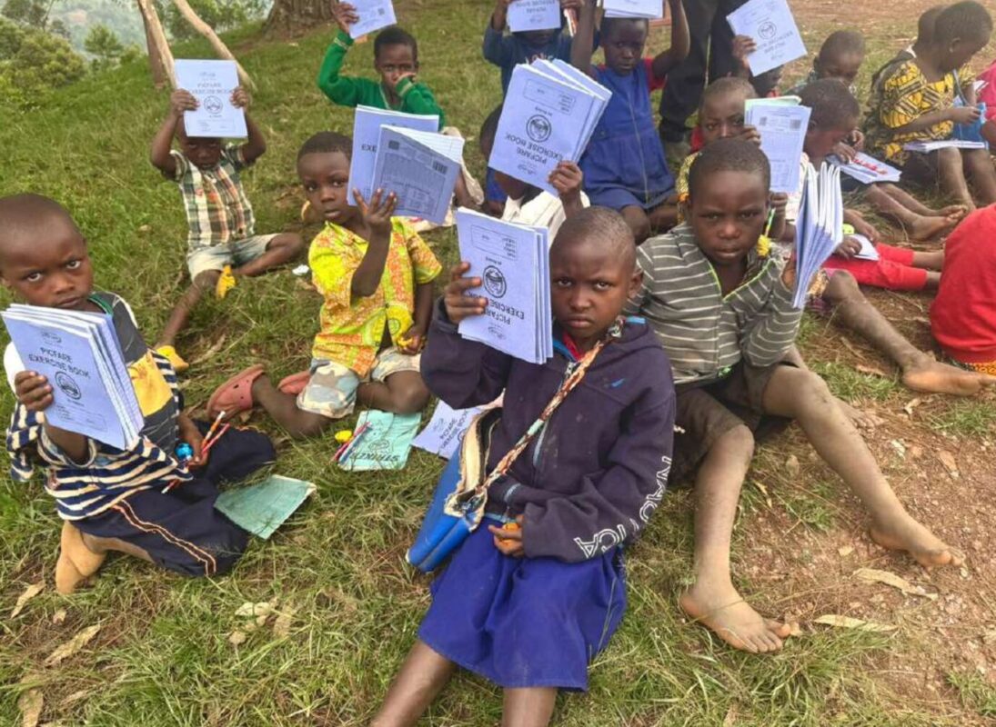 Children at Musamba Primary School showing their notebooks