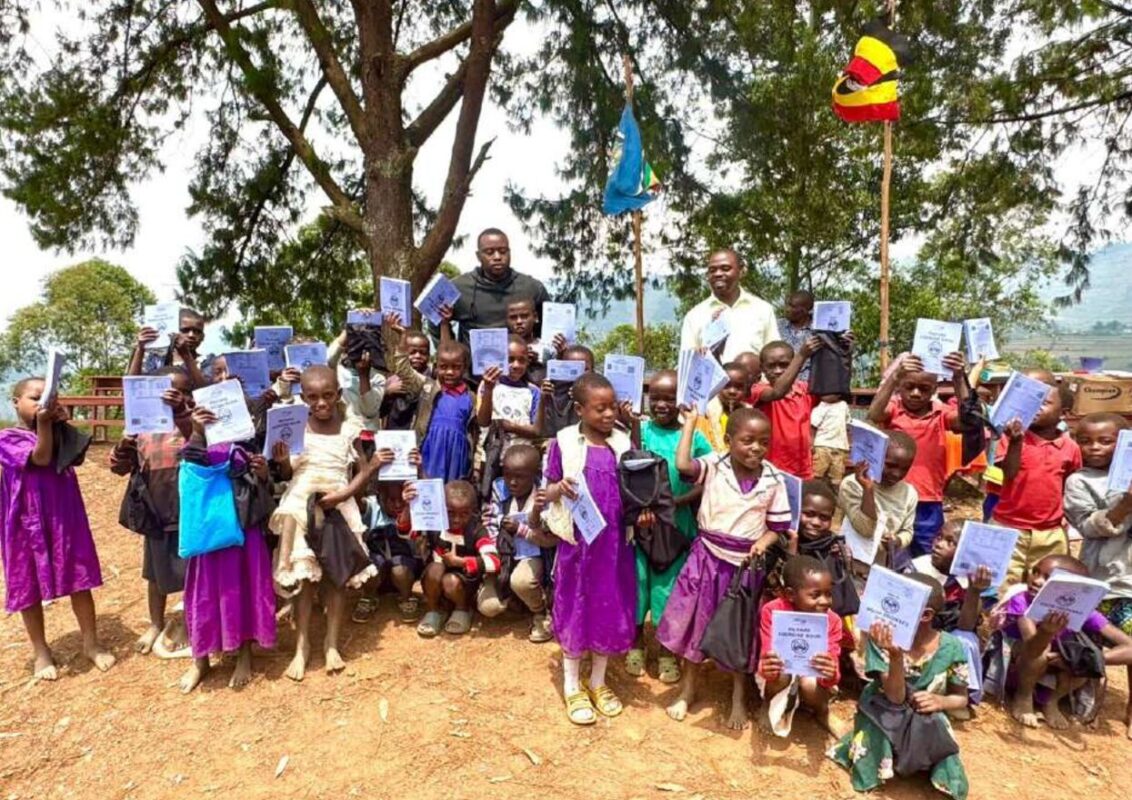 Musamba Primary School students holding new notebooks